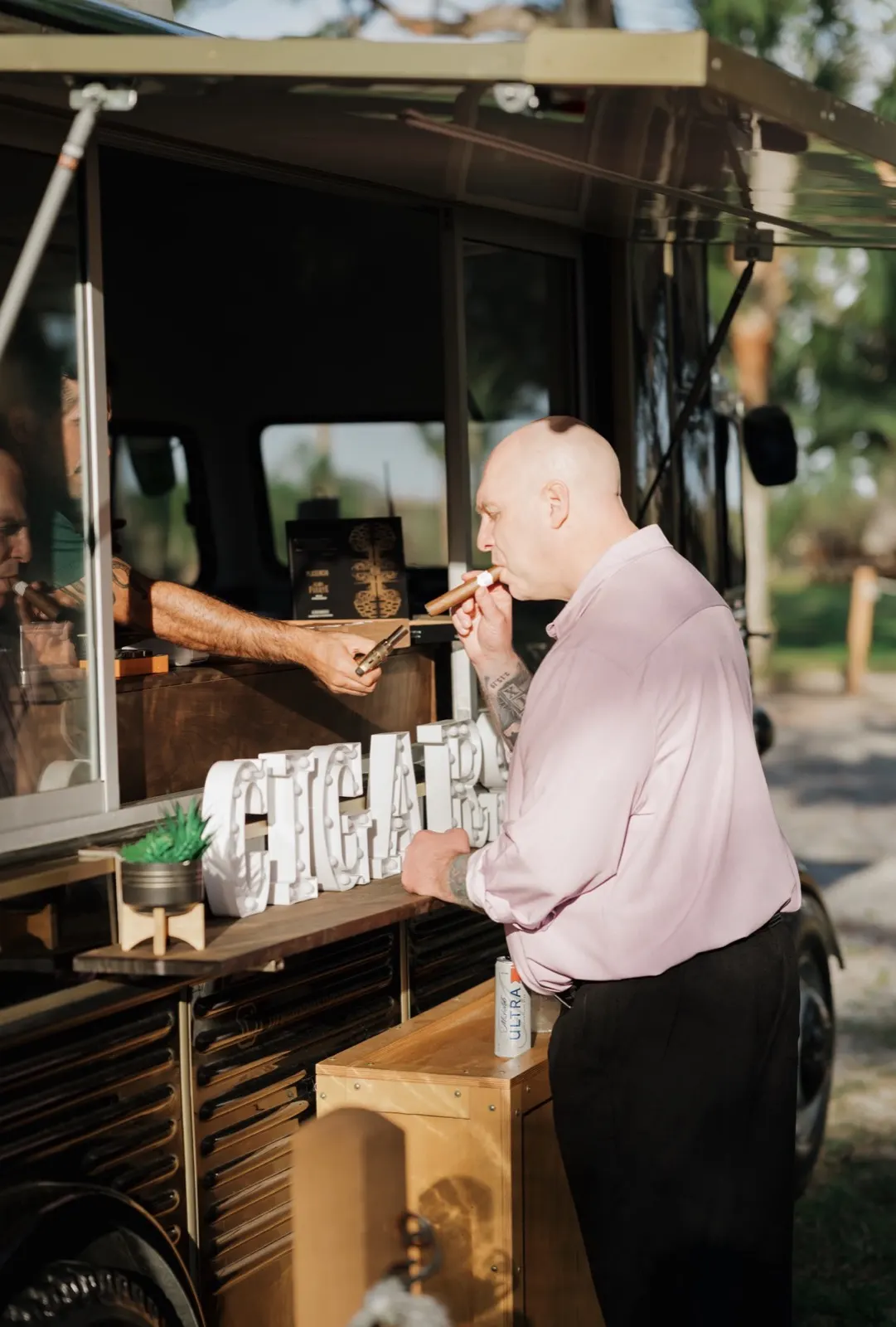 Guests being served at the Fire and Ash cigar bar