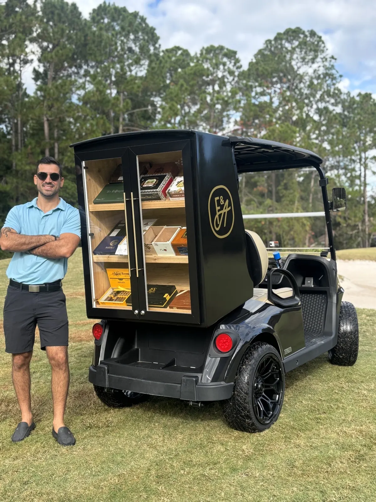 Guest with a cigar at the golf cart humidor