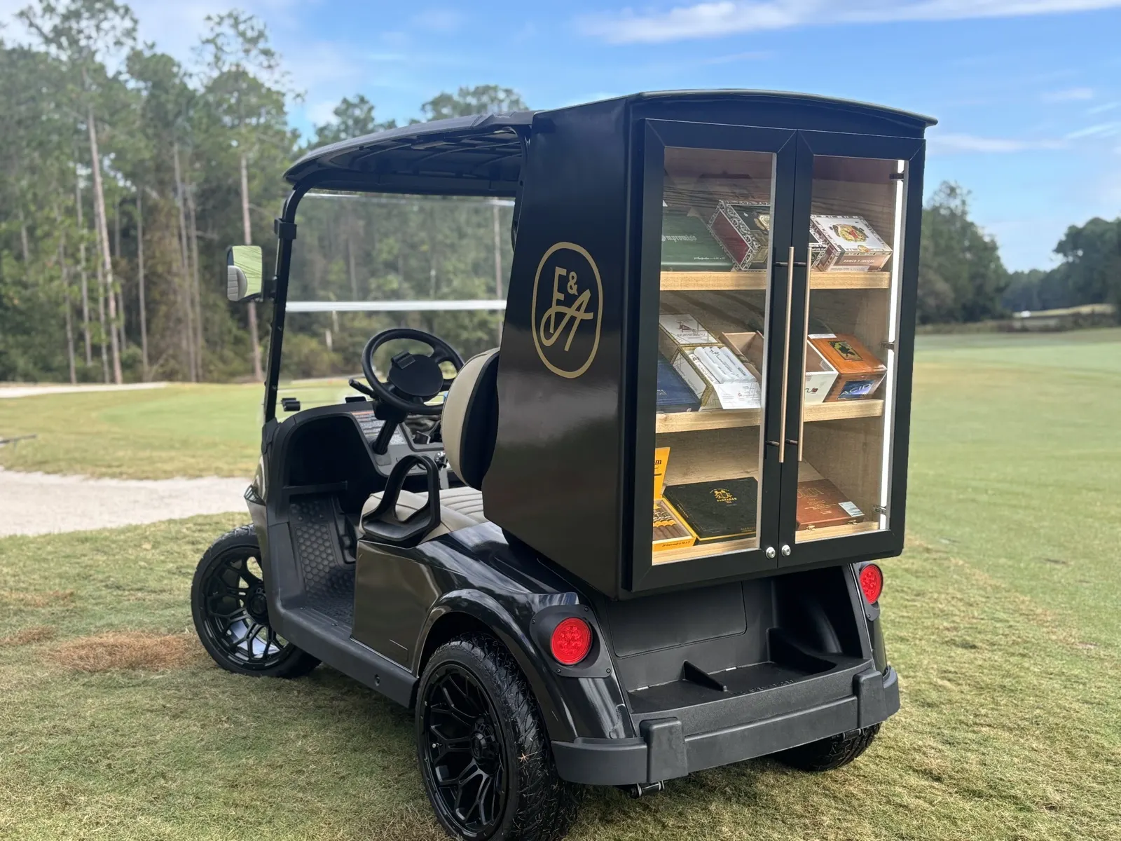 Patent-pending Fire and Ash cigar golf cart on a Florida golf course