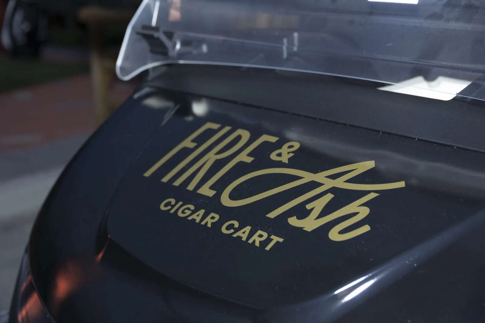 Gold Fire and Ash lettering on the black cigar cart body