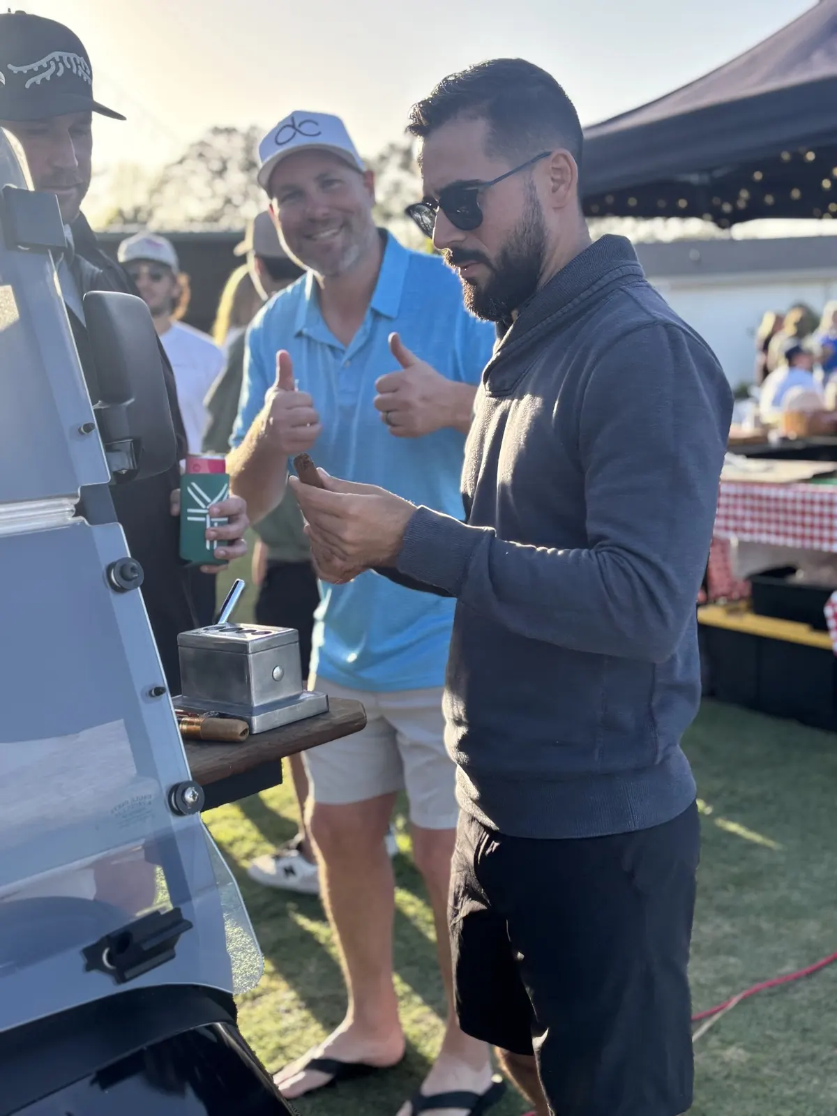 The cigar golf cart serving players during an outing