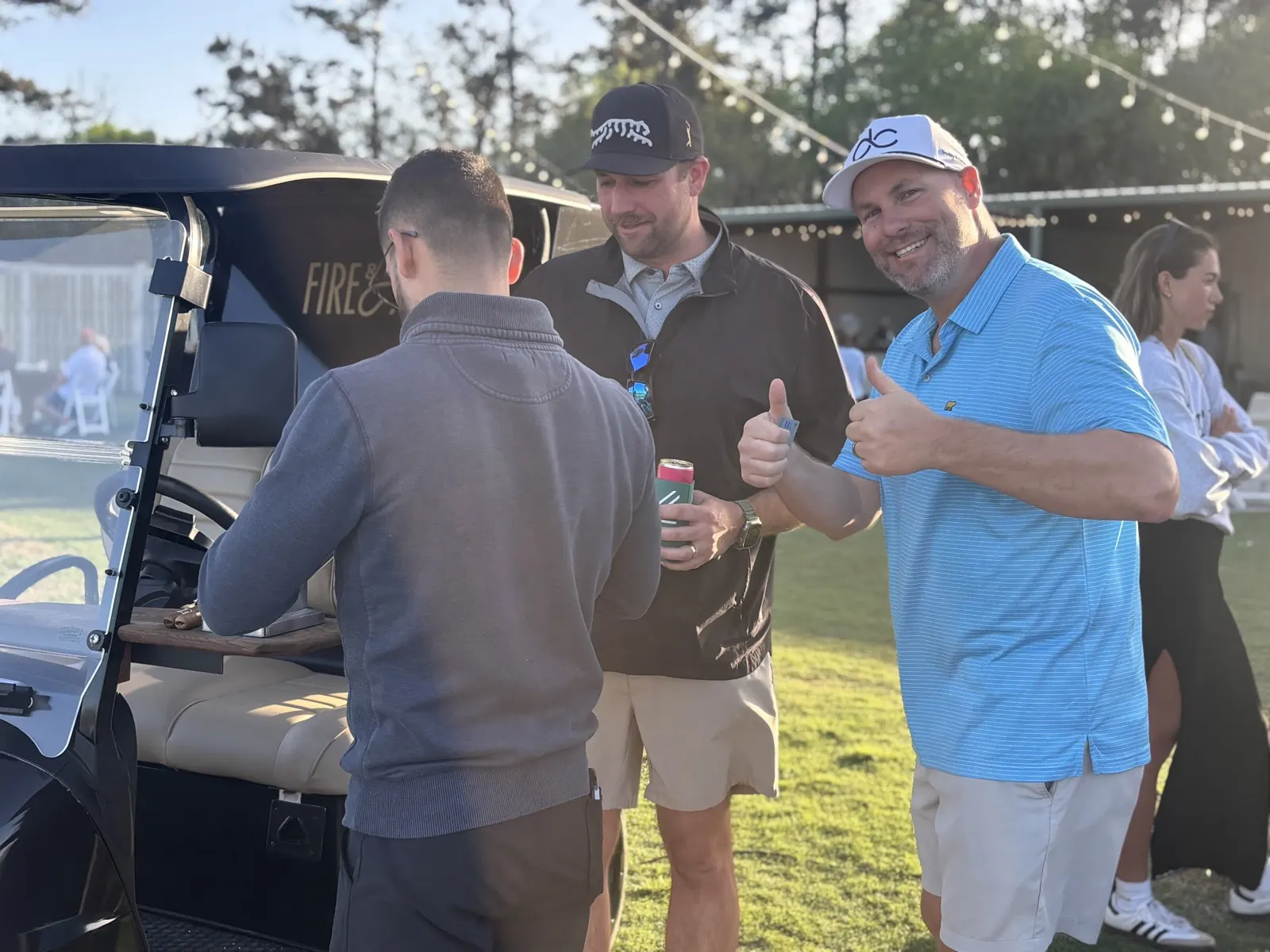 Golfers selecting cigars from the golf cart humidor