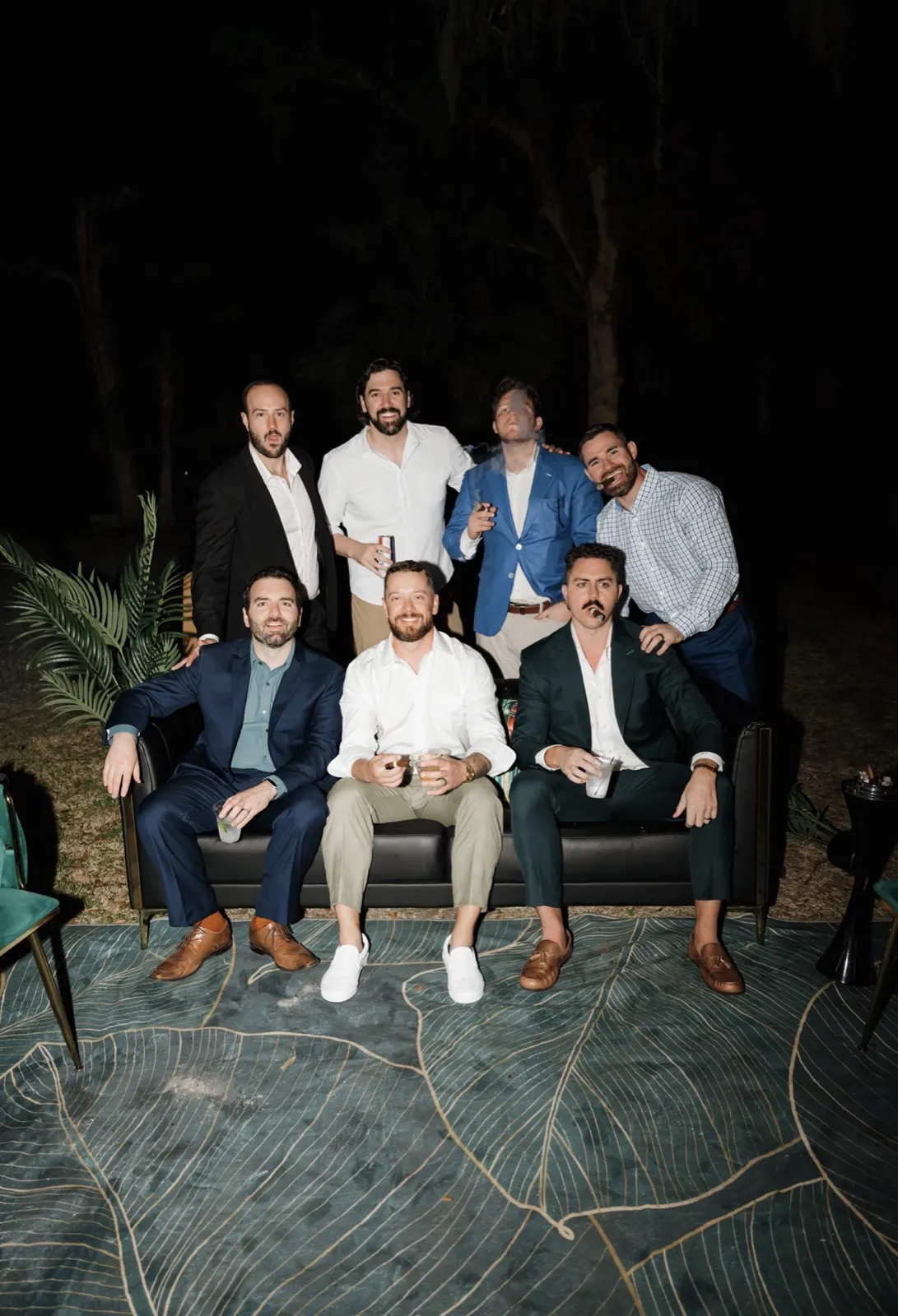 Wedding party relaxing with cigars in the pop-up lounge